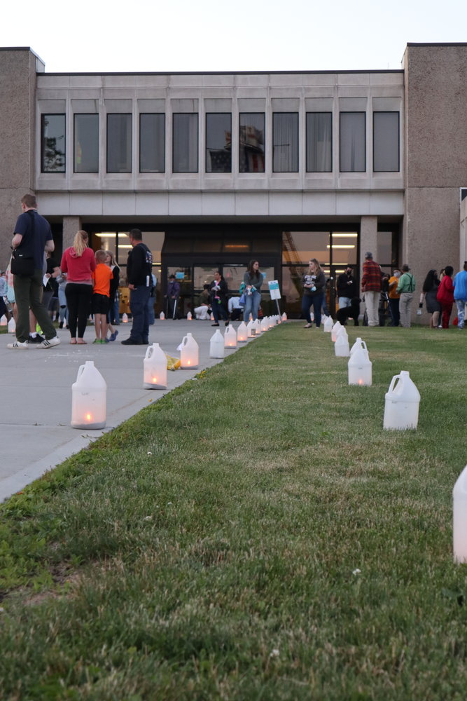 Luminaries to honor the 77 Sullivan County residents who lost their lives due to COVID-19 line the walkway of Sullivan County Government Center on Wednesday evening, June 23.